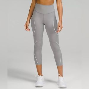 Base Pace High-Rise Reflective Crop 23" in Gull Grey.  Excellent condition